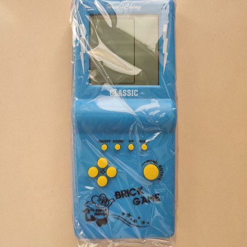 Vintage Tetris handheld game from the 90s, blue, new