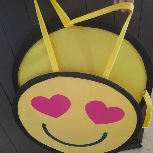Decorative emoji wall hanging with heart eyes