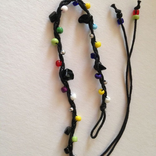 Bracelet used with multicolored beads and black cord