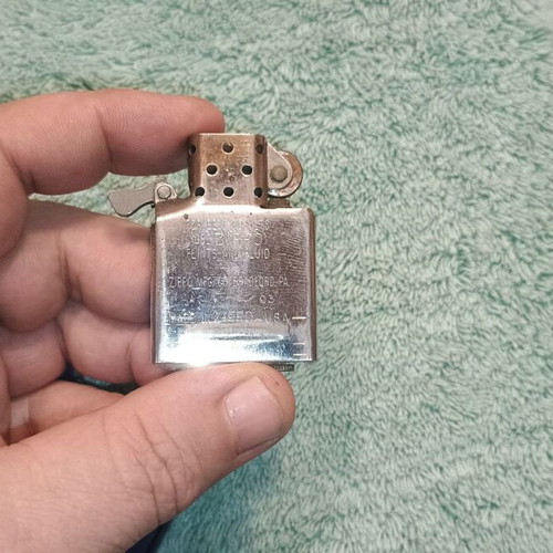 Zippo lighter used blue with purple logo