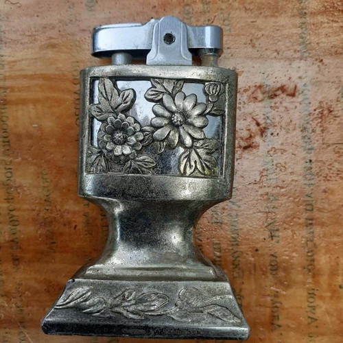 Metal lighter with decorative base, used, collectible