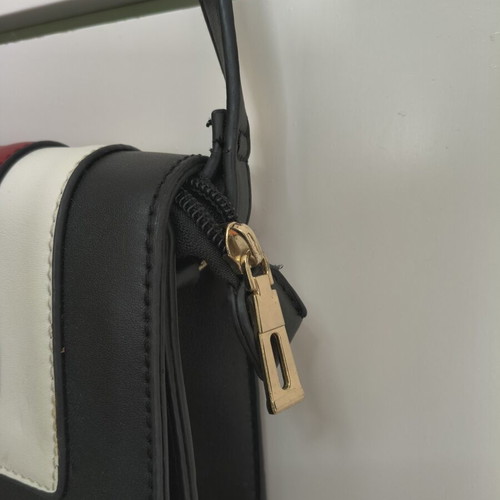 Shoulder bag with adjustable strap, black and red