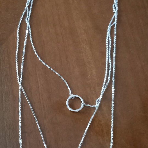 Necklace new with 3 chains and 1 clasp in silver color