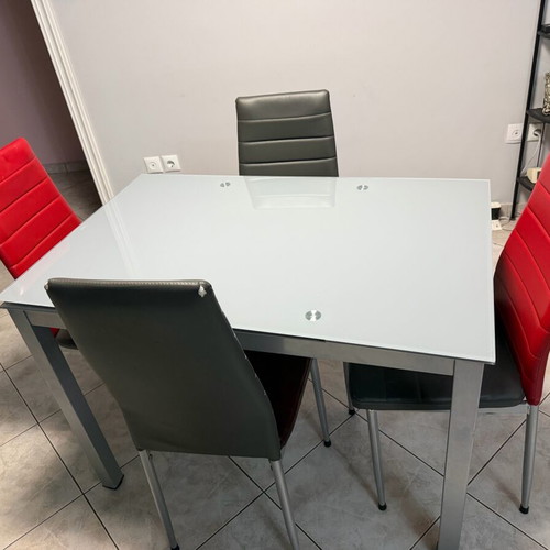 Glass extendable dining table set with 4 chairs used
