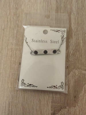 Stainless steel necklace new with plate and 3 black beads