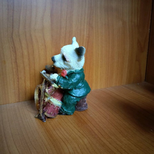 Decorative dog figure with drums like new