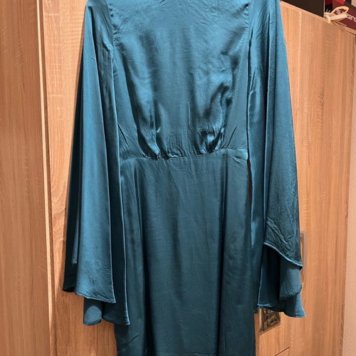 Lace dress used, size Small, with batwing sleeves and open back