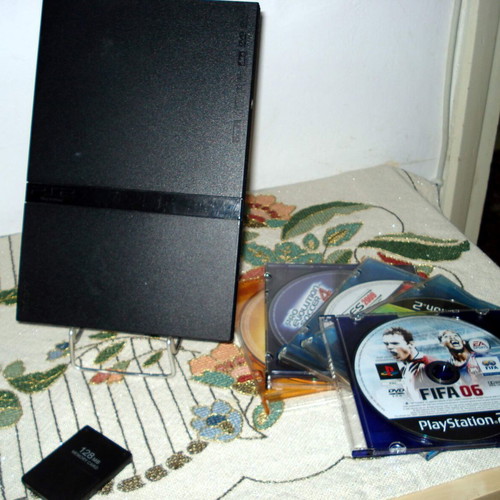 Sony PlayStation 2 Slim SCPH-70004 console bundle with controller and games