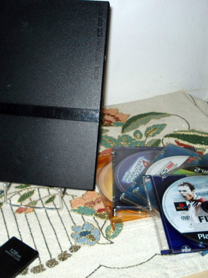 Sony PlayStation 2 Slim SCPH-70004 console bundle with controller and games