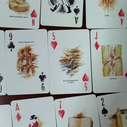 Johnnie Walker collectible playing cards laminated in metal box like new