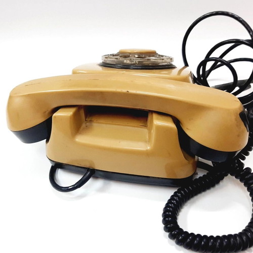 Vintage rotary phone used, beige, 1970s