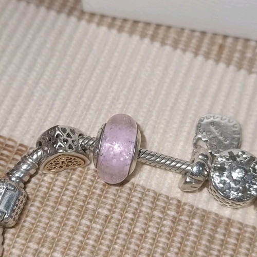 Pandora silver bracelet with 11 charms and collectible clasp, like new