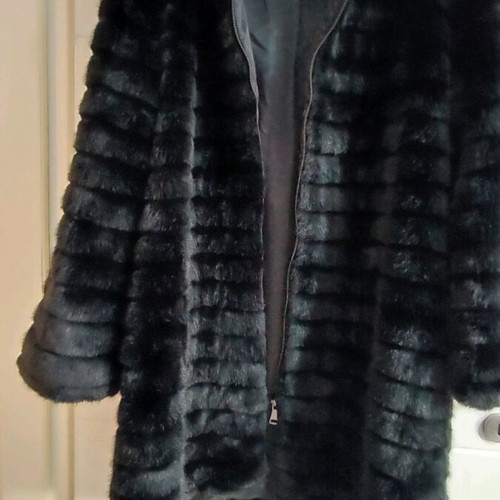 Black faux fur with zipper and hoodie, like new, size M