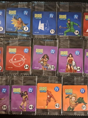 Koukouroukou DC πακέτο με 14 μονά αυτοκόλλητα και άλμπουμ