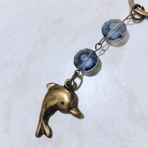 Keychain with dolphin keyholder, like new, gold and blue