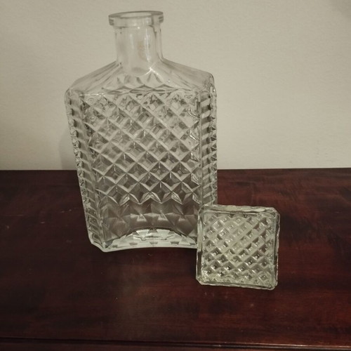 Glass whiskey bottle with embossed design and square stopper, 1980s