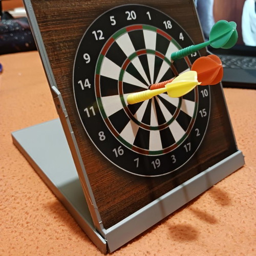 Tabletop dartboard unused with 3 darts
