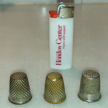 Collection of used thimbles over 40 years old