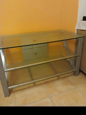 TV stand like new with metal frame and three thick glass shelves