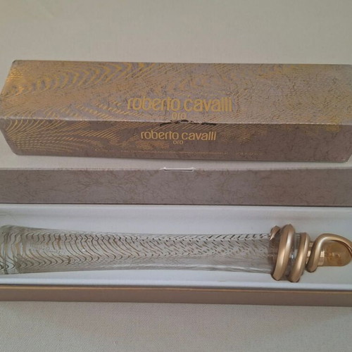 Roberto Cavalli Oro and Christian Dior J'adore empty perfume bottles