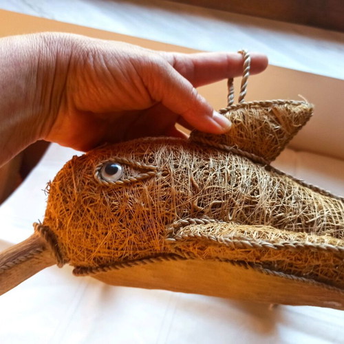 Handmade decorative dolphin made of grass