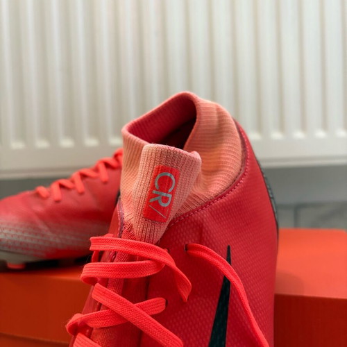 Nike football shoes like new, red and orange