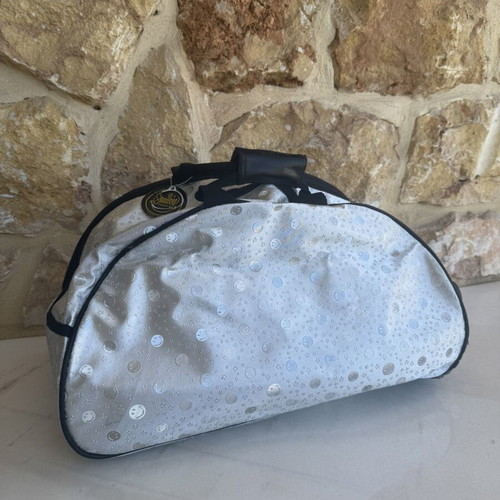 Smiley metallic travel bag used with embossed smiley and star designs