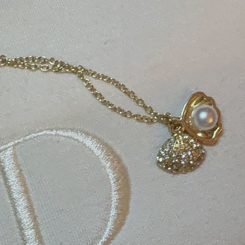 Shell necklace in gold color, new