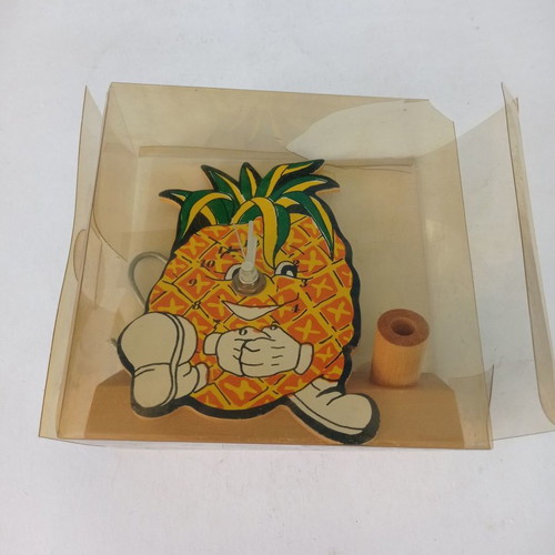 Wooden pineapple analog table clocks used with pen holder