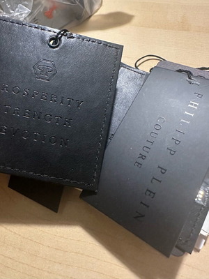 Clothing tags Philipp Plein, Givenchi, Karl, Balenciaga, Alexander McQueen, Kenzo new