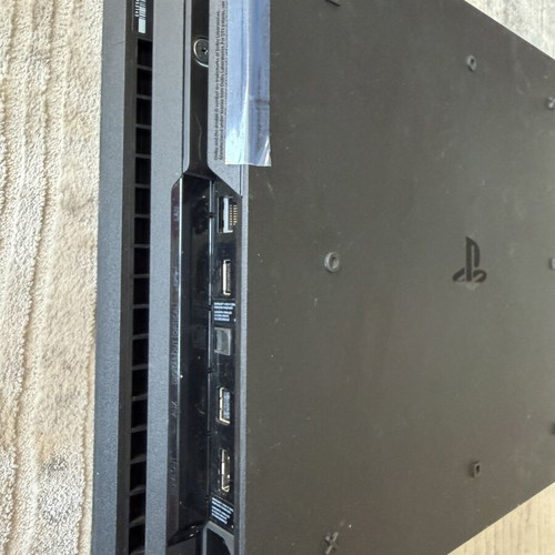 PlayStation 4 Pro 1TB console used with 2 original controllers and games