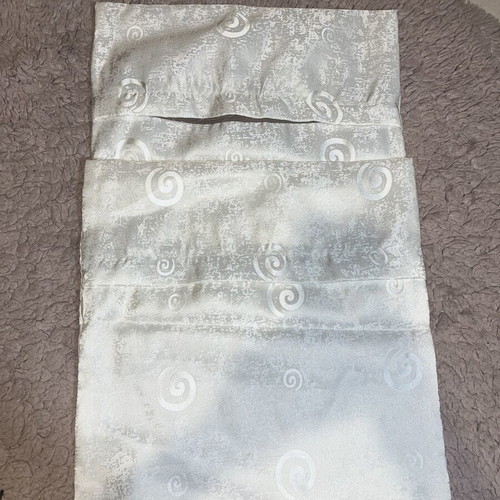 White pillowcases with patterns like new