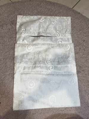 White pillowcases with patterns like new