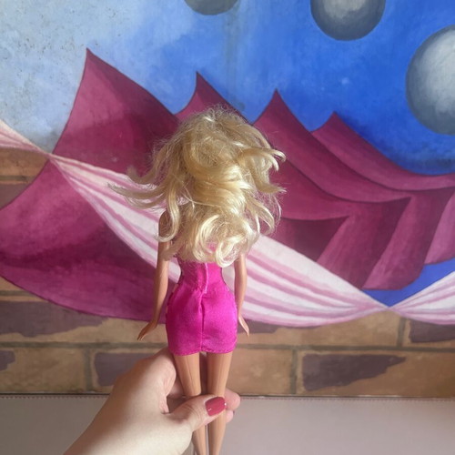Mattel Barbie Beach doll with pink swimsuit and fuchsia dress