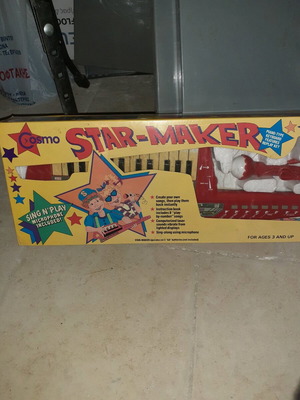 Old piano toy in red color new