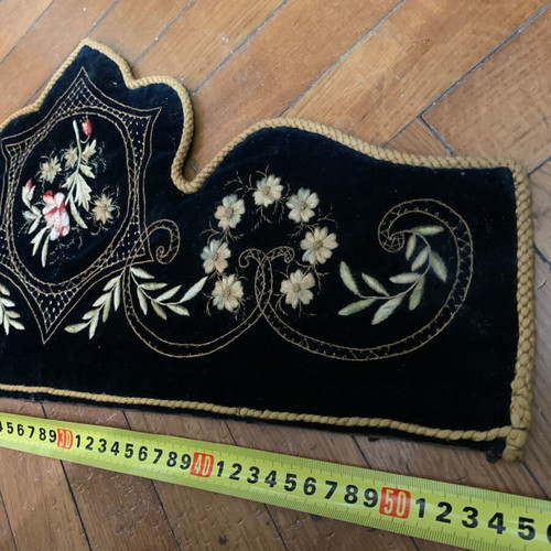 Traditional embroidery used, dark velvet