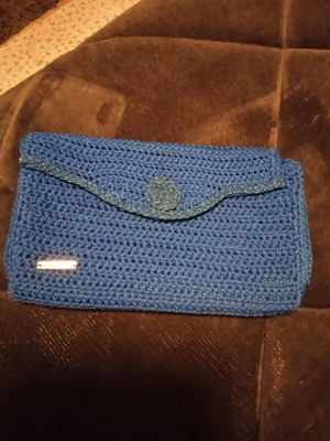 Knitted blue clutch bag hand-held like new with decorative braid