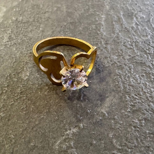 Gold-colored ring used with heart design and zircon stone