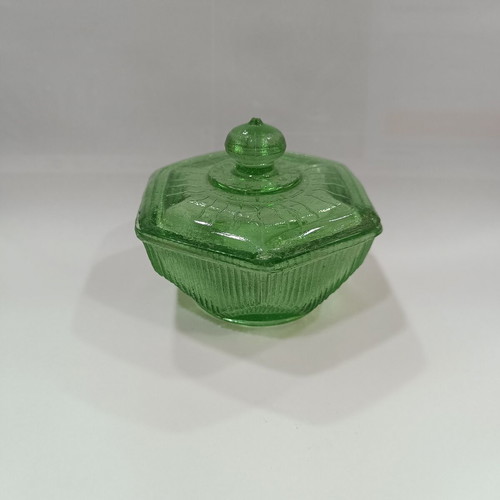 Vintage green pressed glass jewelry box with embossed lid and ridges