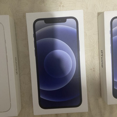 iPhone empty boxes set with AirPods and Apple Watch packaging