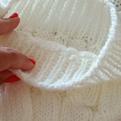 Children's knitted hat with pom pom, like new, white