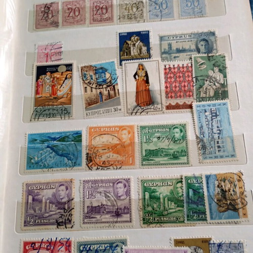 Two stamp albums with stamps from around the world