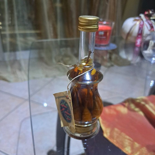 Italian liqueur Cristian di Marko with chili pepper cluster new