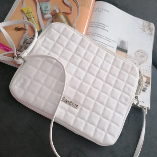 Tablet bag with slight wear on strap