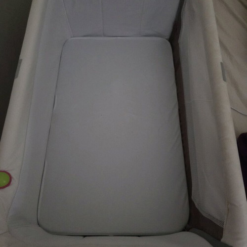 Next to me Zibos baby cot like new with wheels and carrying bag