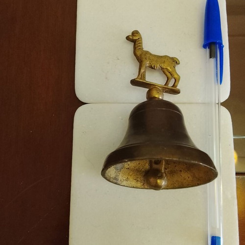 Vintage brass handbell with animal-shaped handle, used, functional