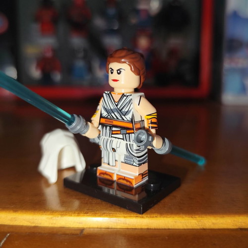 Rey figure like new with base, two blue lightsabers, hood