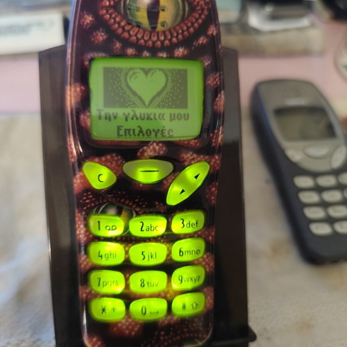 Nokia 3210 vintage cell phone used with new battery and front cover