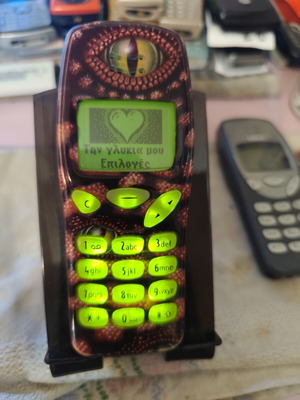 Nokia 3210 vintage cell phone used with new battery and front cover