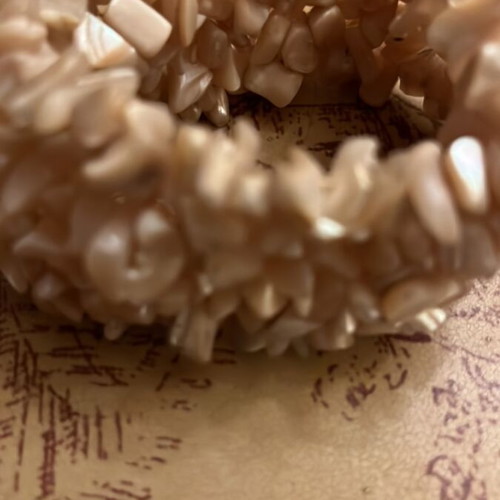 Shell bracelet like new, elastic with natural beige pieces